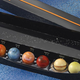 Image for article titled Now you can eat the solar system with these beautiful planet truffles